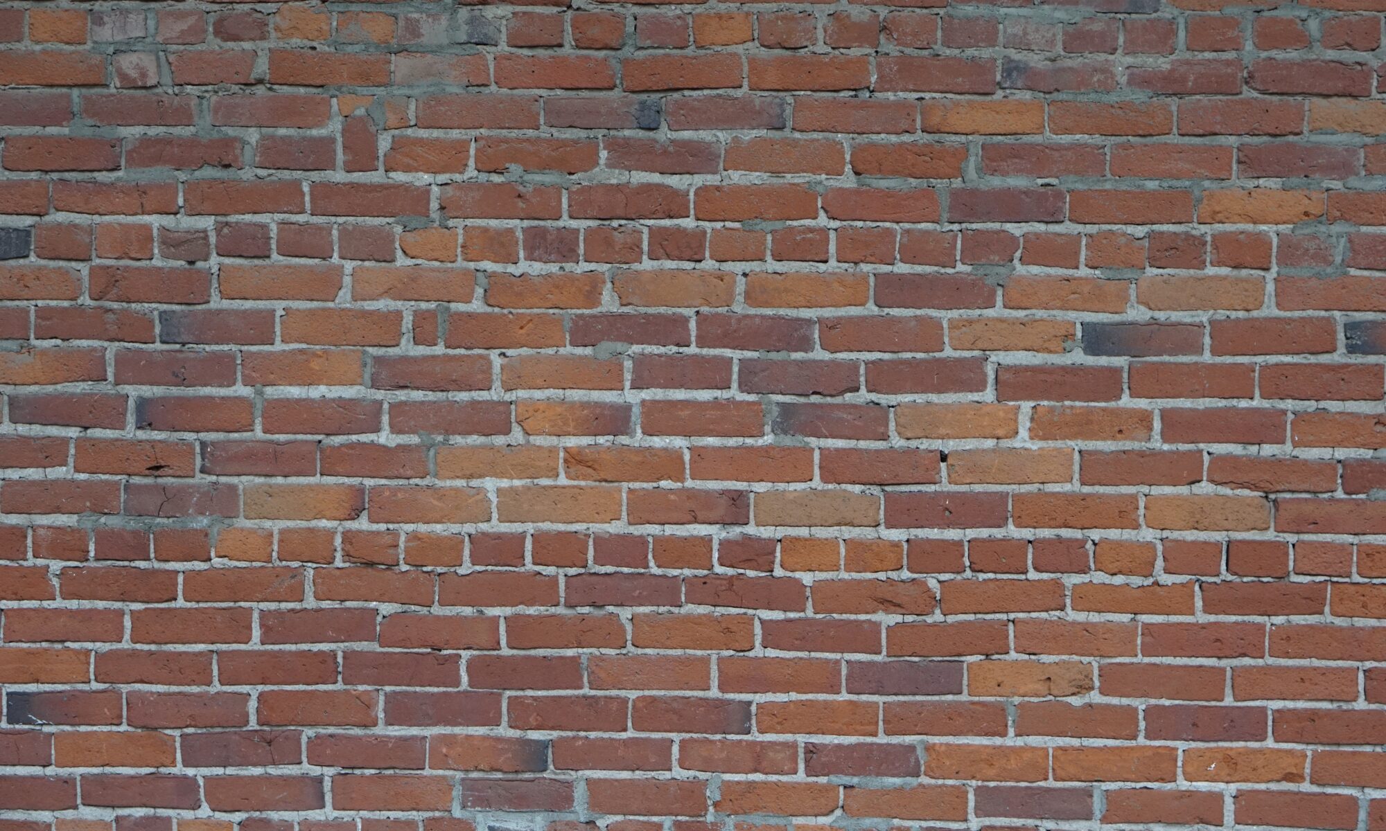 view of red brick wall